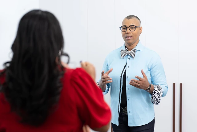 Karen Anastasia Prescod in conversation with another person